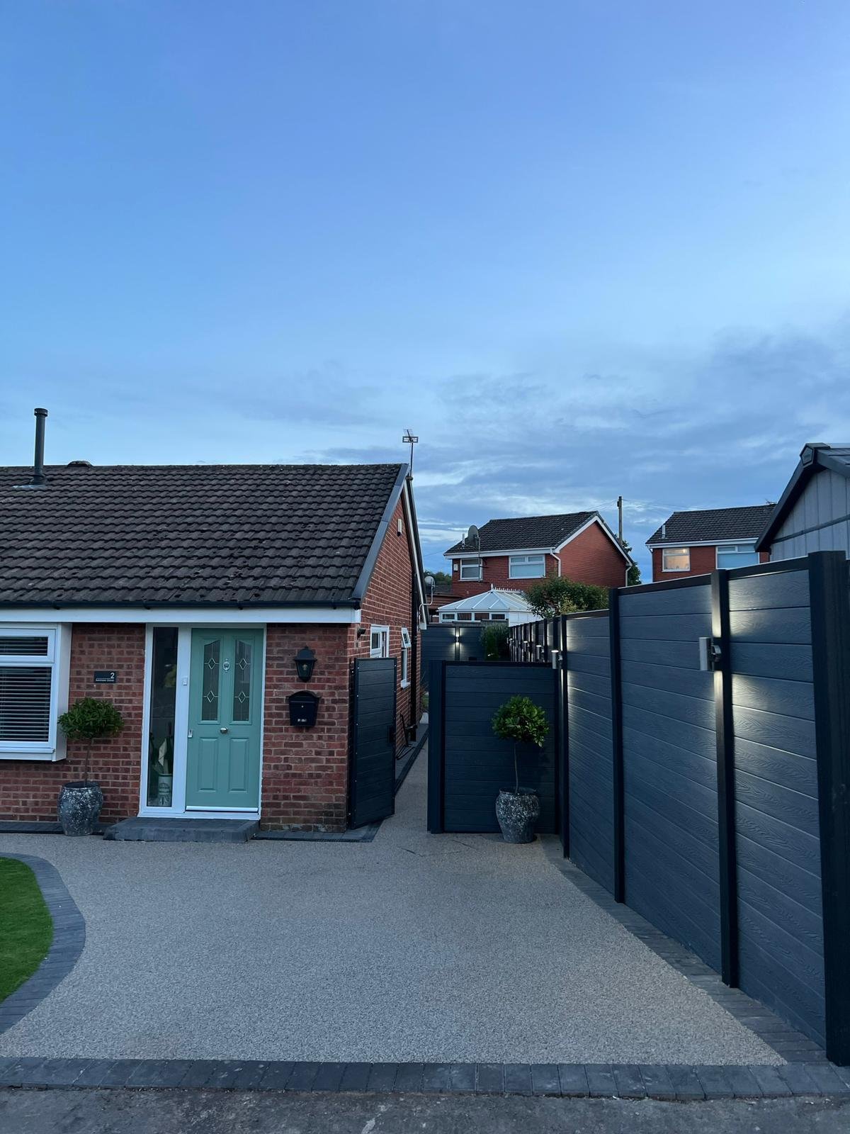 Resin-bound driveway with composite gates