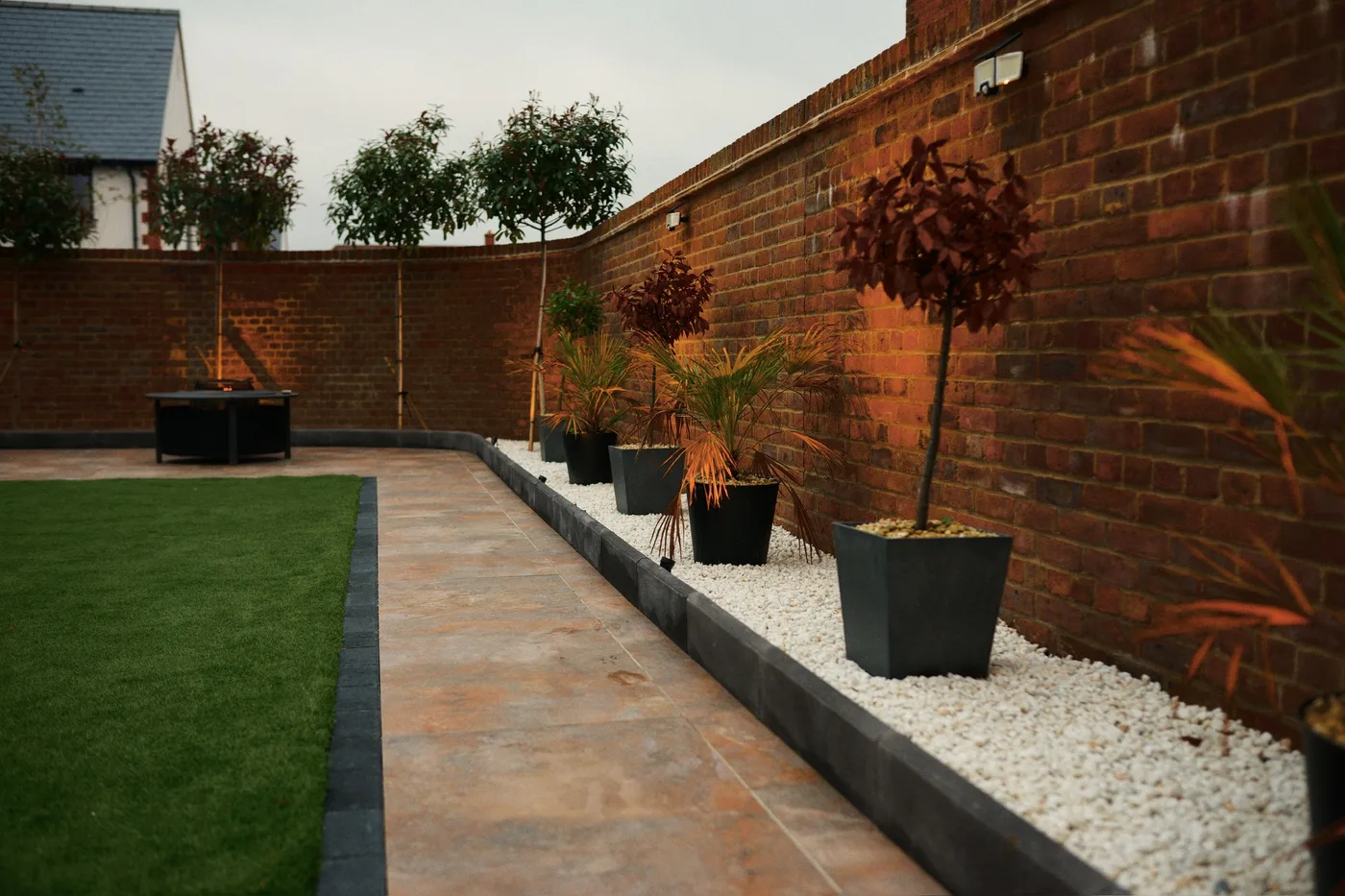 Artificial grass garden with decorative planters