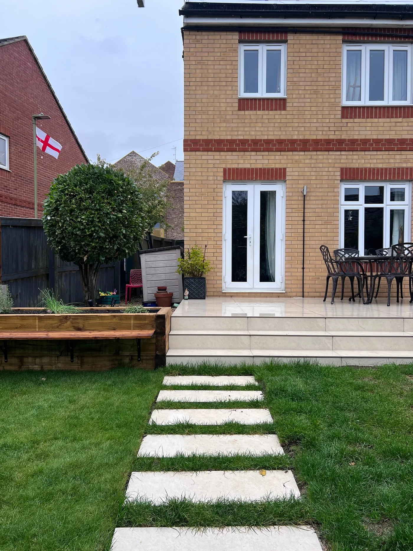 Garden with stepping stones and raised beds