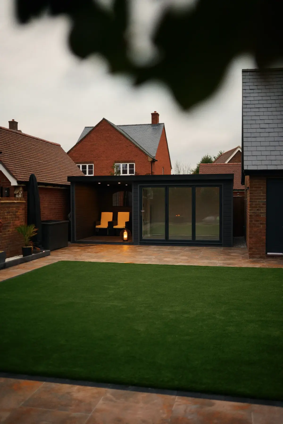 Garden room with fire pit at dusk